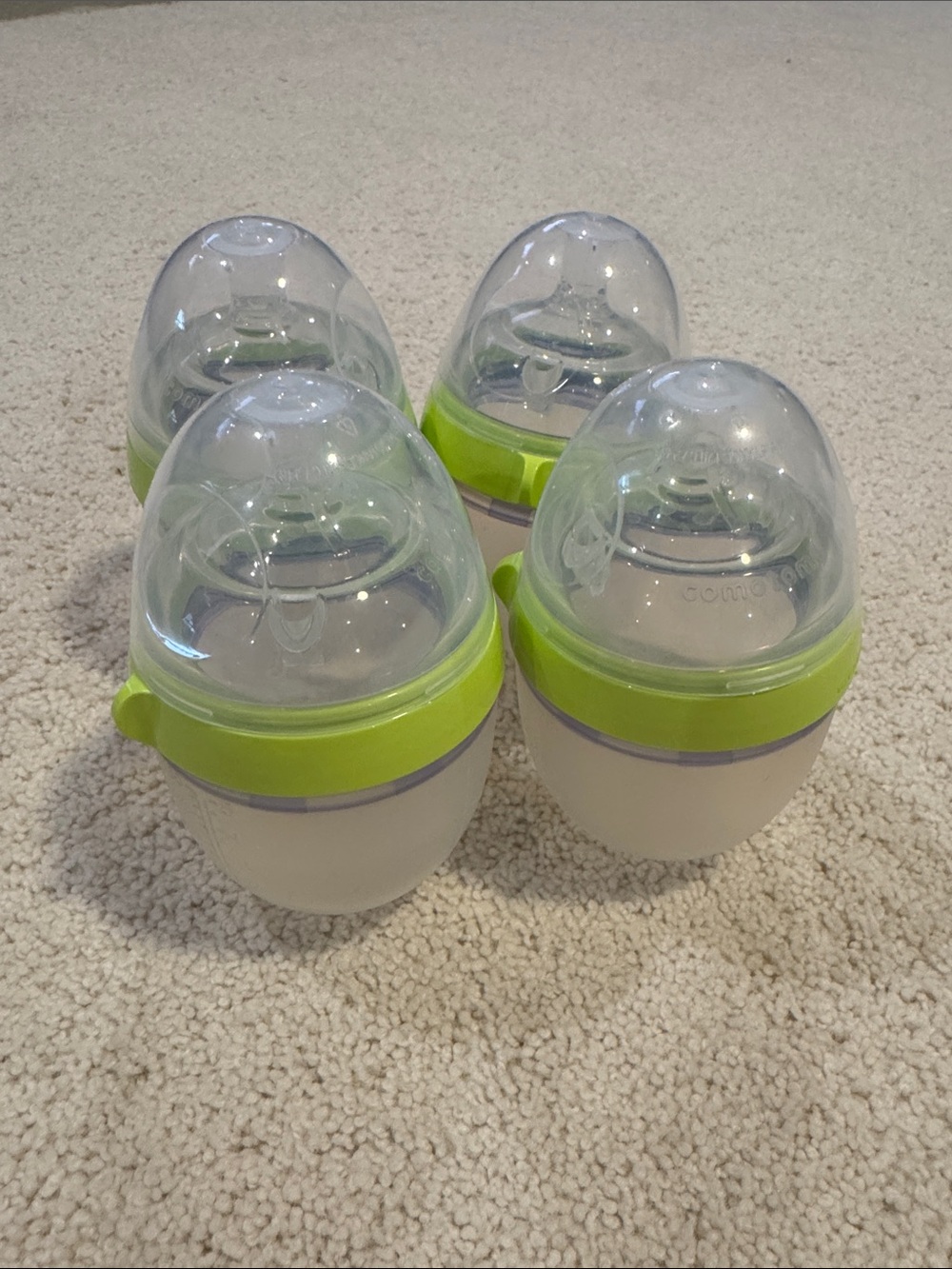 4 green comotomo bottles